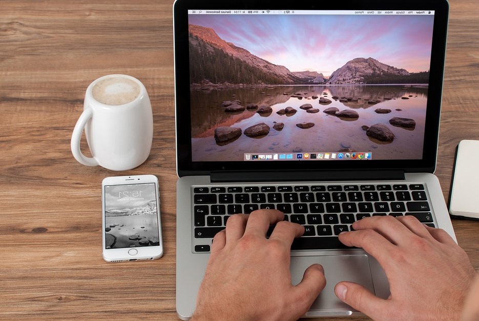 man's hand typing